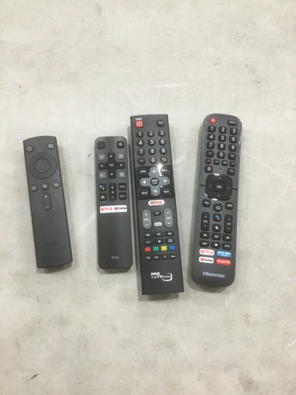 Photo 1 of Bundle of four assorted remotes, sold as is. Nonrefundable 