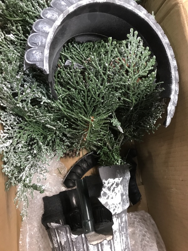 Photo 2 of (BROKEN BASE; BENT POWER PLUG)
4' Feel Real® Frosted Mountain Spruce Entrance Tree with Cones in Silver Brushed Urn & 100 Clear Lights
