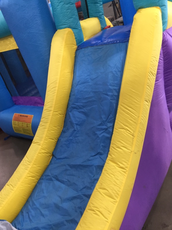 Photo 6 of Bounceland Pop Star Inflatable Bounce House Bouncer, Large Bouncing Area with Long Slide, Climbing Wall, Basketball Hoop, UL 1HP Blower Included, 15 ft x 13 ft x 8.3 ft H, Pop Star Kids Party Theme *** minor dirt markings***
