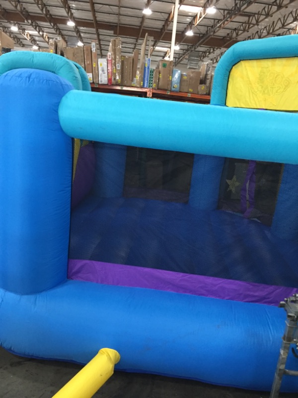 Photo 3 of Bounceland Pop Star Inflatable Bounce House Bouncer, Large Bouncing Area with Long Slide, Climbing Wall, Basketball Hoop, UL 1HP Blower Included, 15 ft x 13 ft x 8.3 ft H, Pop Star Kids Party Theme *** minor dirt markings***
