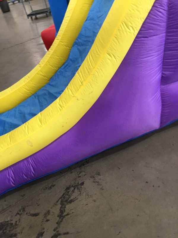 Photo 5 of Bounceland Pop Star Inflatable Bounce House Bouncer, Large Bouncing Area with Long Slide, Climbing Wall, Basketball Hoop, UL 1HP Blower Included, 15 ft x 13 ft x 8.3 ft H, Pop Star Kids Party Theme *** minor dirt markings***
