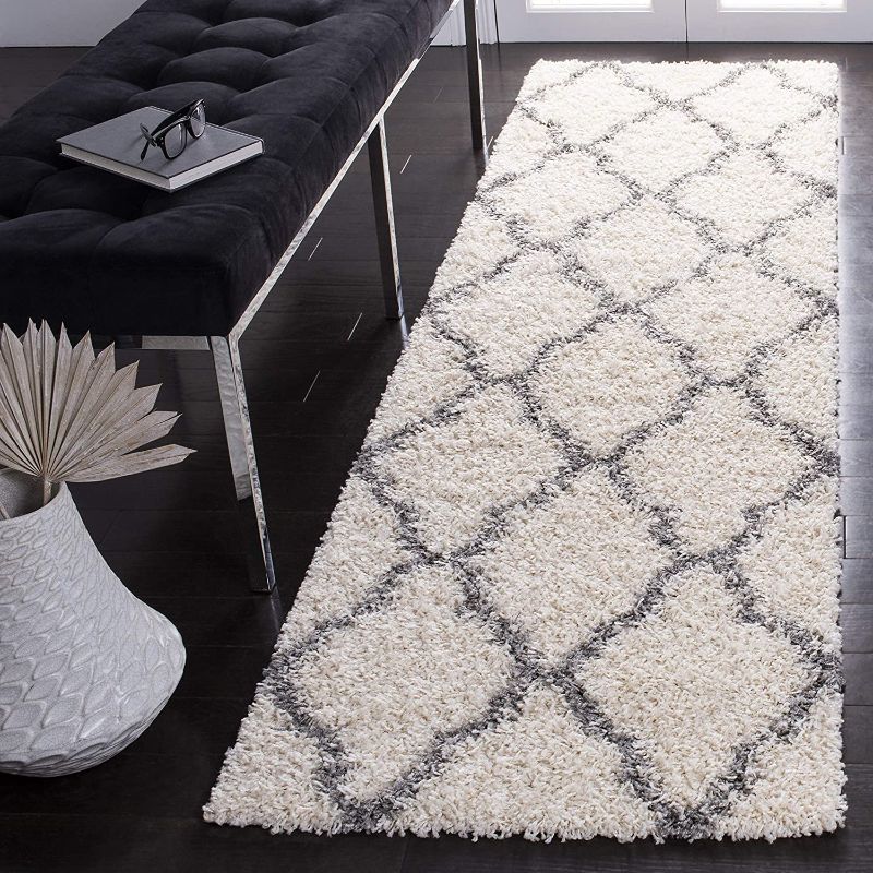 Photo 1 of 
2 x 6 white and lback diamon detail rug
