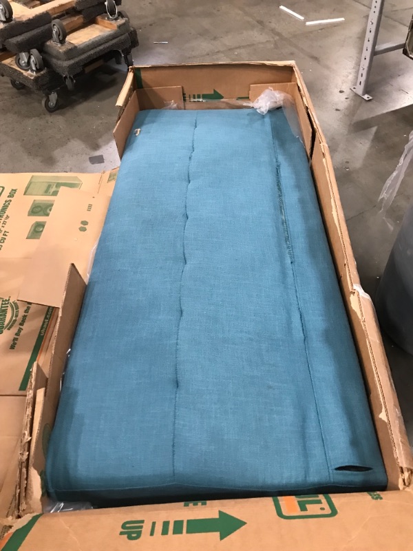 Photo 1 of 64" blue padded couch (Unknown brand) 
- Minor cosmetic damaged 