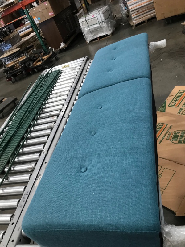 Photo 2 of 64" blue padded couch (Unknown brand) 
- Minor cosmetic damaged 