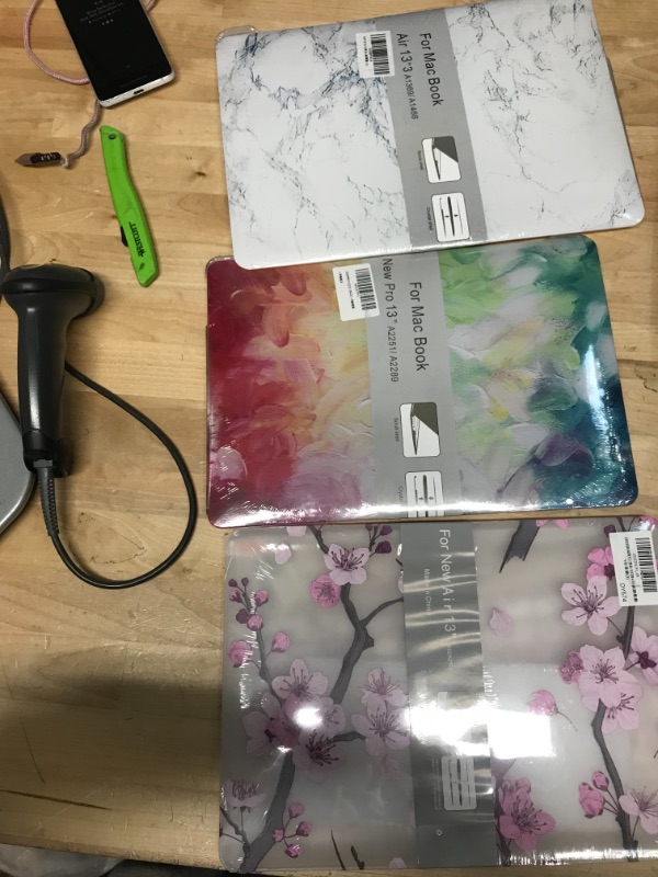 Photo 1 of BUNDLE OF MACBOOK 13" AND 13.3 CASES/TABLET CASE
