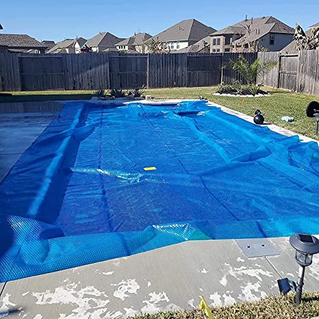 Photo 1 of (TORN MATERIAL) 
blue pool tarp