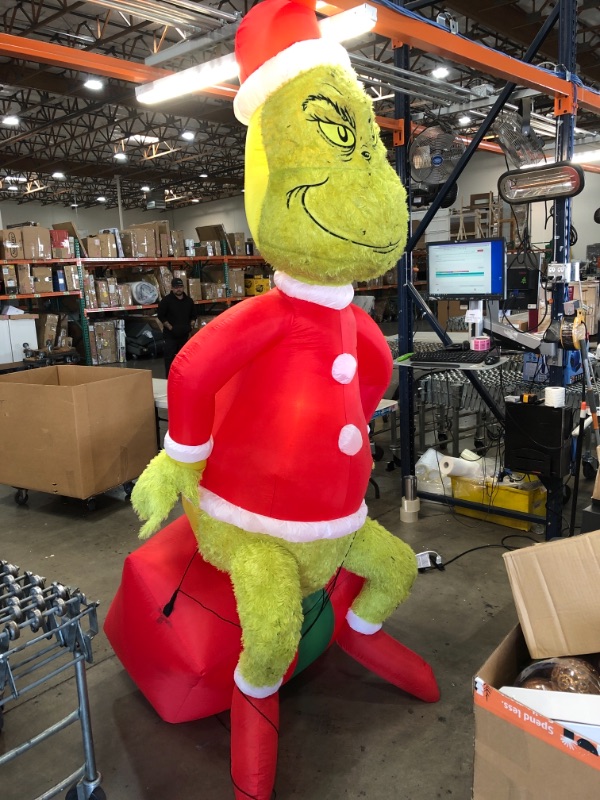 Photo 2 of  9.5 ft Pre-Lit LED Airblown Dr. Seuss Fuzzy Plush Grinch on Present Christmas Inflatable
