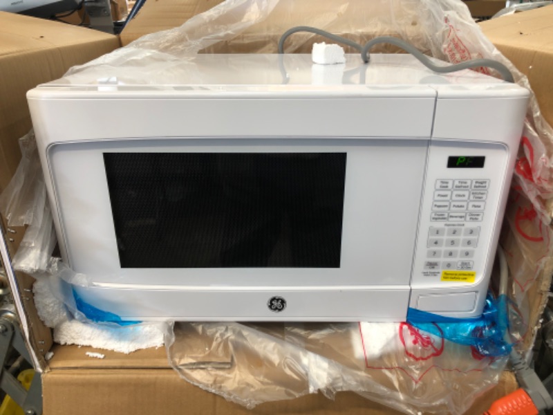 Photo 2 of TESTED WORKS**
GE 1.1 cu. ft. Countertop Microwave in White