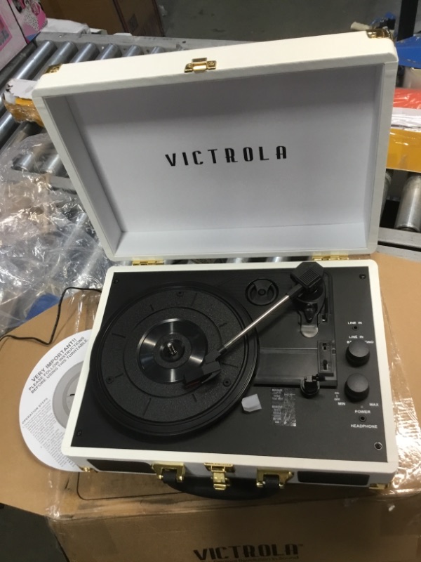 Photo 2 of **DOES NOT POWER ON**
Victrola Vintage 3-Speed Bluetooth Portable Suitcase Record Player with Built-in Speakers | Upgraded Turntable Audio Sound| Includes Extra Stylus | White (VSC-550BT-WH)
