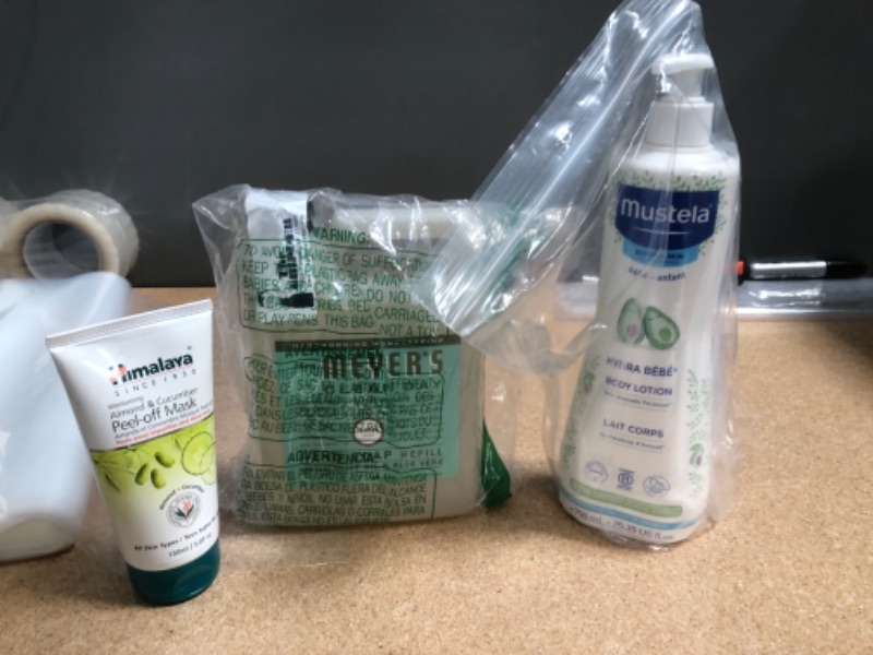 Photo 1 of NON-REFUNDABLE BAG OF ASSORTED ITEMS;
including; hand soap, mask and lotion 