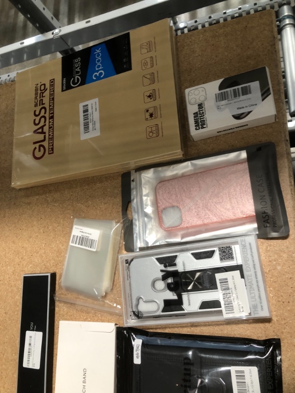 Photo 2 of NON-REDUNDABLE BAG OF ASSORTED ITEMS; 
including; screen protectors, card covers, watch bands and assorted phone cases 