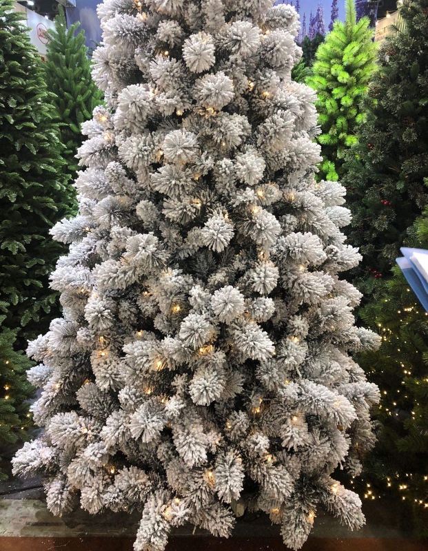 Photo 1 of **DOESN'T LIGHT UP**
AMERIQUE 691322310863 8 FEET Premium Artificial Full Body Shape Christmas Tree with Metal Stand, Snow, Unlit, 8', Heavily Flocked, Snowy
