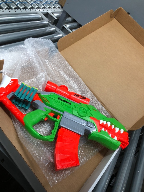 Photo 2 of NERF DinoSquad Rex-Rampage Motorized Dart Blaster, 10-Dart Clip, 20 Official Darts, 10-Dart Storage- T-Rex Dinosaur Design
