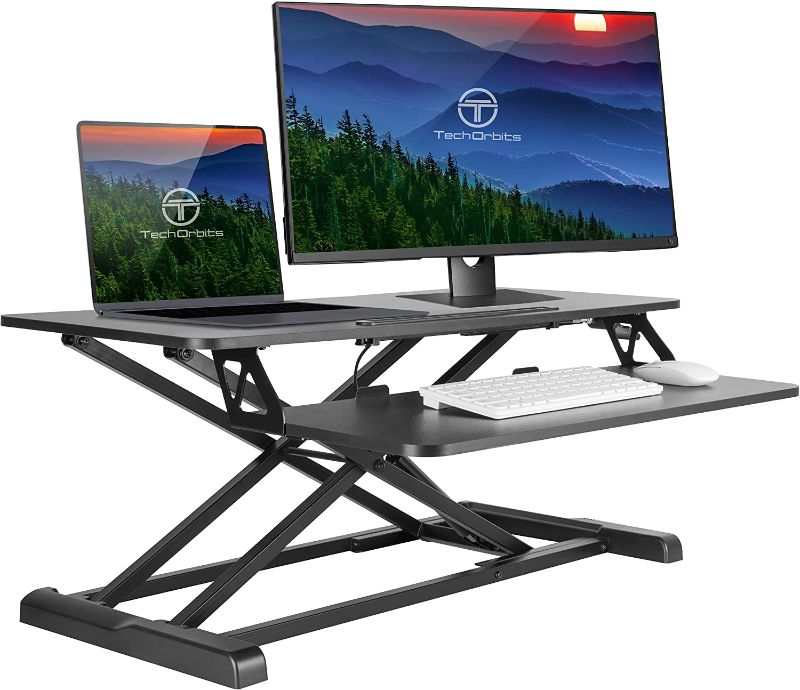 Photo 1 of TechOrbits Standing Desk Converter - 32 Inch Particle Board, Adjustable Height Sit to Stand Up Desk Riser for Home Office - Computer, Laptop & Dual Monitor Workstation - Black
