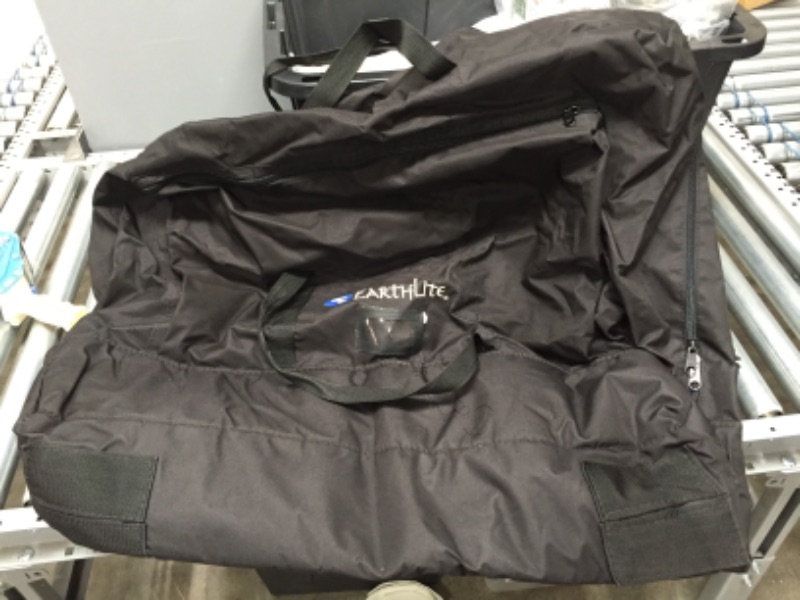 Photo 1 of **GENERAL POST*
black earthlite duffle bag, has holes on the side