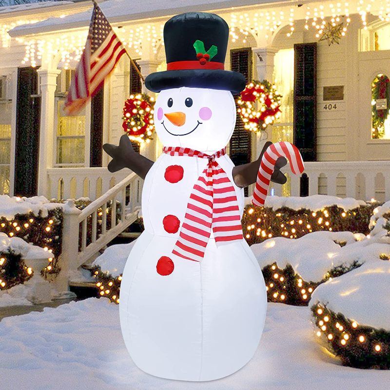 Photo 1 of (**LIGHTS UP BUT DOES NOT INFLATE**
ATDAWN 5ft Christmas Inflatables Blow Up Yard Decorations, Inflatable Snowman Christmas Outdoor Decoration, Blow Up Snowman with Candy Cane for Christmas Yard Garden Decorations
