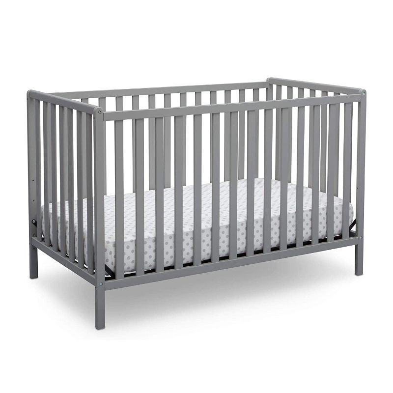 Photo 1 of Delta Children Heartland 4-in-1 Convertible Crib, Grey + Delta Children Twinkle Galaxy Dual Sided Recycled Fiber Core Crib and Toddler Mattress (Bundle)
