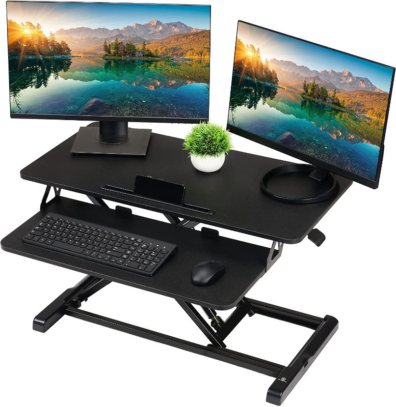 Photo 1 of TechOrbits Standing Desk Converter - 32 Inch MDF Wood Adjustable Sit to Stand Up Desk Riser - Black