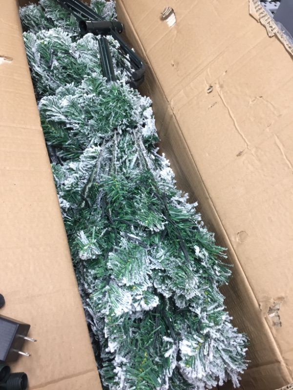 Photo 2 of *USED*
SUNYPLAY 6ft Snow Flocked Christmas Tree Prelit Artificial Pencil Christmas Tree with 200 Lights 490 Tips for Christmas Indoor and Outdoor Decor 
