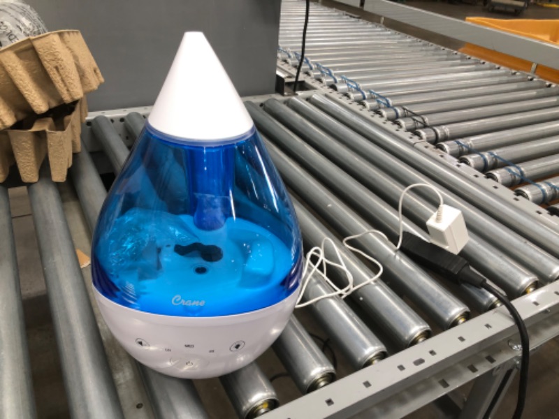 Photo 3 of *Tested and does not function*
Crane 4-in-1 Drop Ultrasonic Cool Mist Humidifier, 1 Gallon, Top Fill Humidifier, 24 Hour Run Time, with Optional Sound Machine and Color Changing Nightlight, Blue/White
