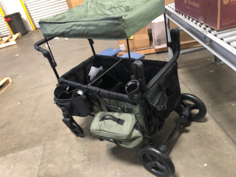 Photo 2 of (WHEEL SWIVEL LOCKS WHILE PUSHING) 
Jeep Deluxe Wrangler Stroller Wagon by Delta Children