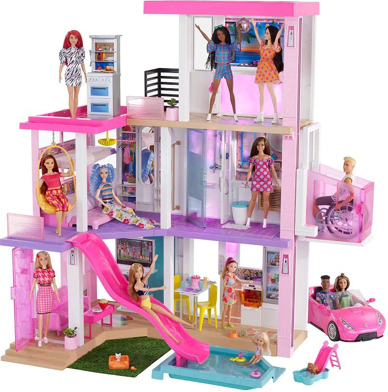 Photo 1 of Barbie Dreamhouse (3.75-ft) 3-Story Dollhouse Playset with Pool & Slide, Party Room, Elevator, Puppy Play Area, Customizable Lights & Sounds, 75+ Pieces, Gift for 3 to 7 Year Olds, New for 2021