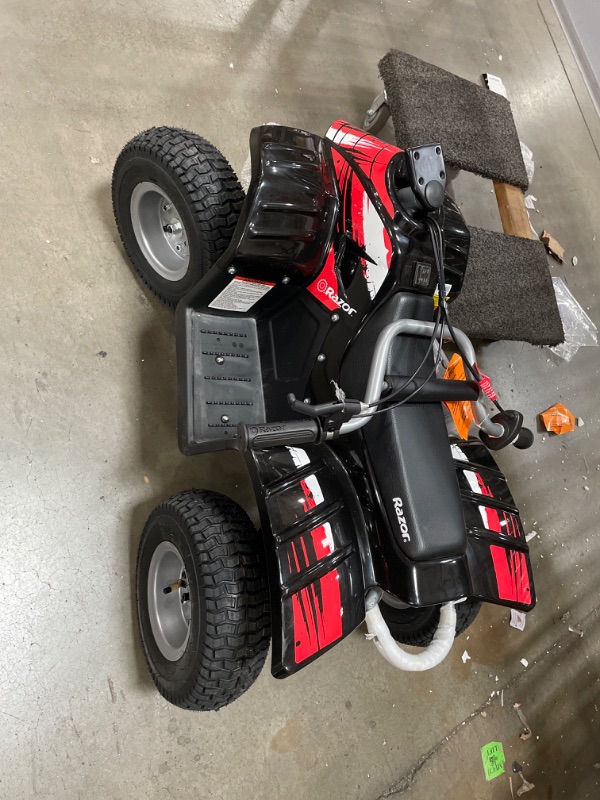 Photo 2 of Razor Dirt Quad - 24V Electric 4-Wheeler ATV - Twist-Grip Variable-Speed Acceleration Control, Hand-Operated Disc Brake, 12" Knobby Air-Filled Tires