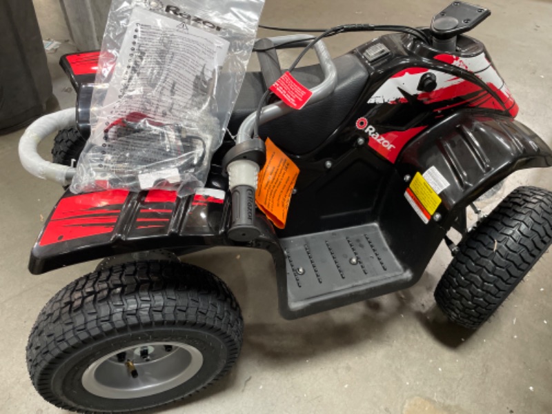 Photo 5 of Razor Dirt Quad - 24V Electric 4-Wheeler ATV - Twist-Grip Variable-Speed Acceleration Control, Hand-Operated Disc Brake, 12" Knobby Air-Filled Tires