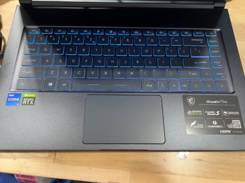 Photo 6 of **FACTORY SEALED**
MSI Stealth 15M Gaming Laptop: 15.6" 144Hz FHD 1080p Display, Intel Core i7-11375H, NVIDIA GeForce RTX 3060, 16GB, 512GB SSD, Thunderbolt 4, WiFi 6, Win10, Carbon Gray (A11UEK-009)