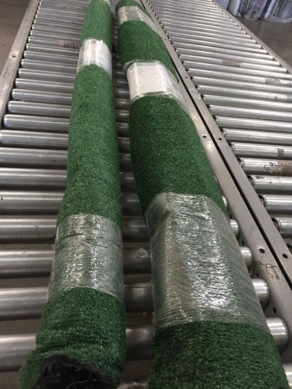 Photo 2 of 2 TrafficMaster
6 ft. x 8 ft. Green Artificial Grass Rug *** NEW WITH DIRT DAMAGE****