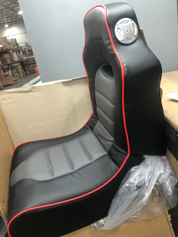 Photo 2 of *SEE last picture for damage*
X Rocker, 5172601, Surge Wireless Bluetooth 2.1 Sound Video Gaming Floor Chair with Bonded Faux Leather and Mesh Upholstery, 36.81 x 32.28 x 20.89, Black with Red
