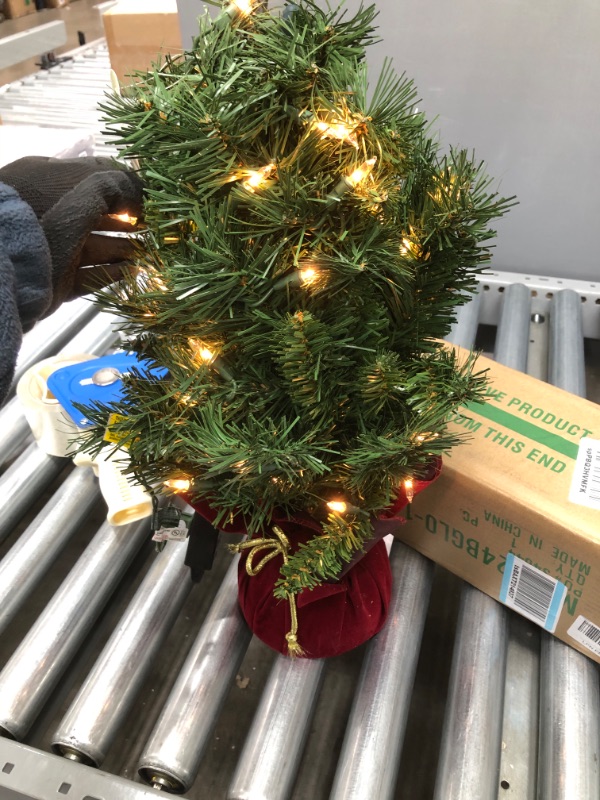 Photo 1 of *SEE last picture for damage*
National Tree Company Pre-lit Artificial Mini Christmas Tree | Includes Small Lights and Cloth Bag Base | Majestic Fir - 2 ft
