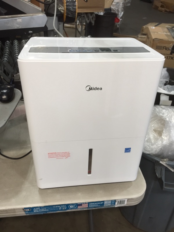 Photo 1 of Midea 1,500 Sq. Ft. Energy Star Certified Dehumidifier with Reusable Air Filter 22 Pint 2019 DOE (Previously 30 Pint) - Ideal For Basements, Medium to Large Rooms and Bathrooms (White)