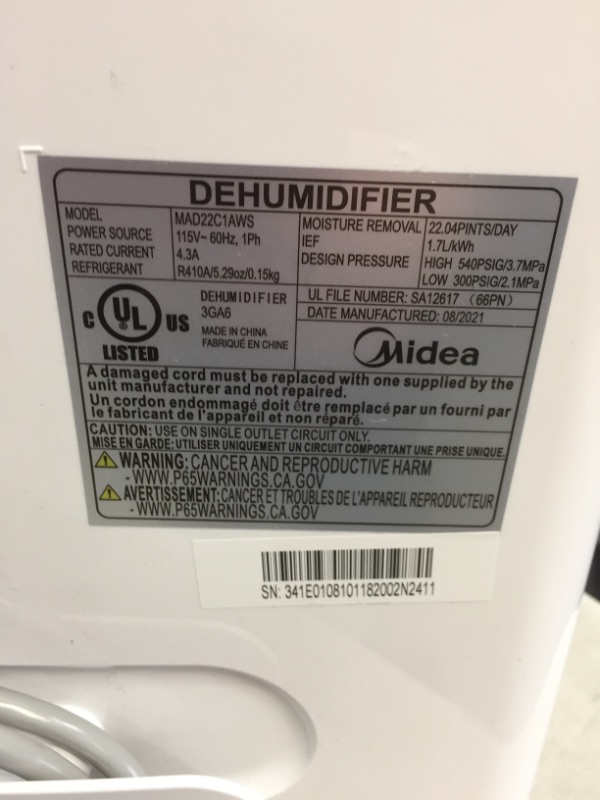 Photo 1 of Midea 1,500 Sq. Ft. Energy Star Certified Dehumidifier with Reusable Air Filter 22 Pint 2019 DOE (Previously 30 Pint) - Ideal For Basements, Medium to Large Rooms and Bathrooms (White)