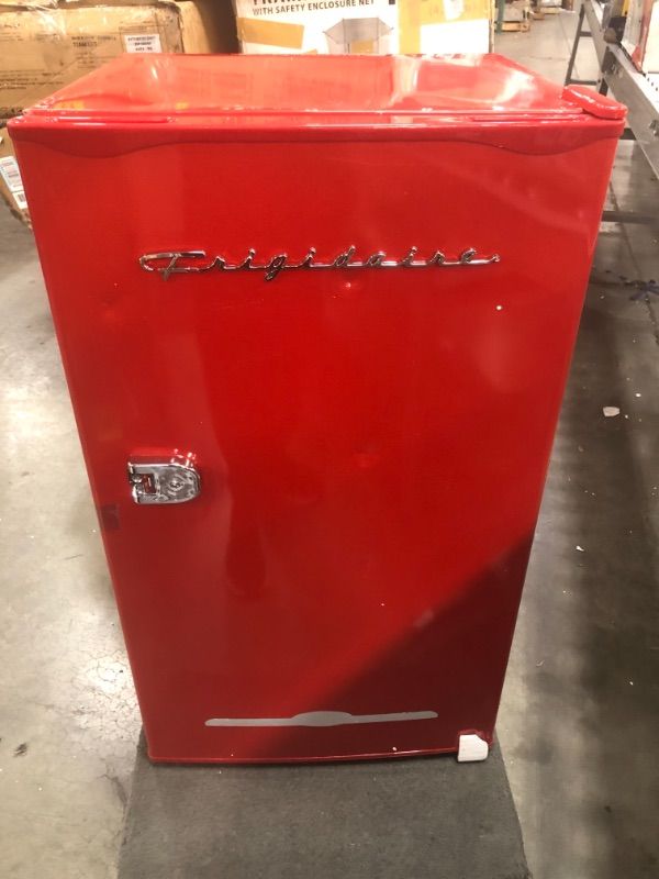 Photo 2 of ONLY THE FREEZER IS GETTING COLD 
Frigidaire Retro Bar Fridge Refrigerator with Side Bottle Opener, 3.2 cu. ft, Red