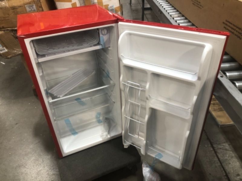 Photo 3 of ONLY THE FREEZER IS GETTING COLD 
Frigidaire Retro Bar Fridge Refrigerator with Side Bottle Opener, 3.2 cu. ft, Red