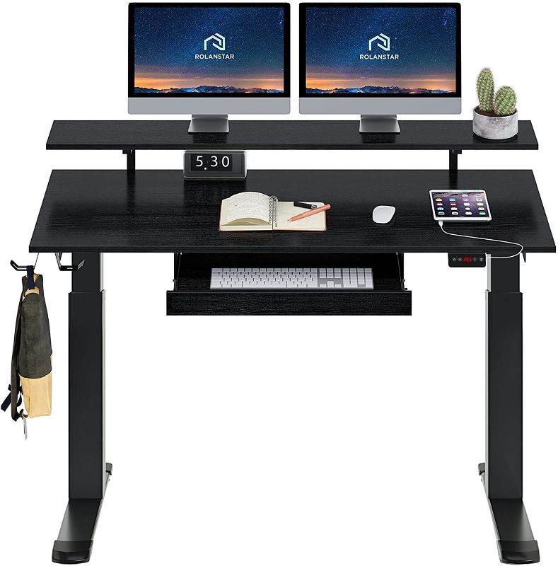 Photo 1 of Rolanstar Height Adjustable Desk 47", Standing Desk with Keyboard Tray and Monitor Shelf, Electric Standing Table with Double Headphone Hooks, Rustic Brown
**LOOSE MISSING HARDWARE**
