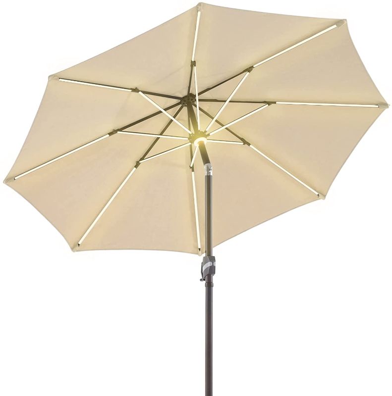 Photo 1 of BLUU 9 FT Patio Umbrella Solar Ourdoor Umbrellas LED Table Umbrellas with 16 LED Strip Lights & Hub Light, Aluminum Frame, Premium 3-Year Nonfading Olefin Fabric (Cream Beige)
