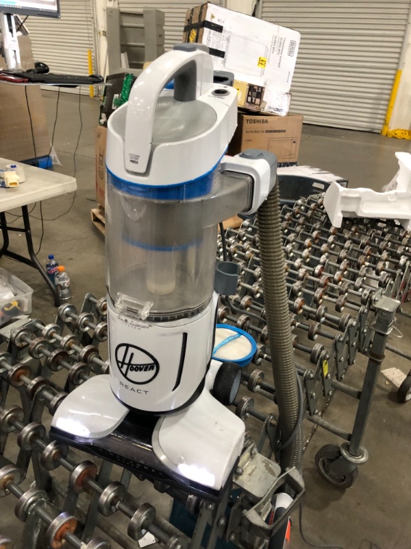 Photo 1 of Hoover React QuickLift Bagless Upright Corded Vacuum Cleaner, for Allergens and Pets, UH73301, White **POWERS ON. MISSING EXTENDABLE WAND AND ACCESSORIES. BRUSHES DONT SPIN.