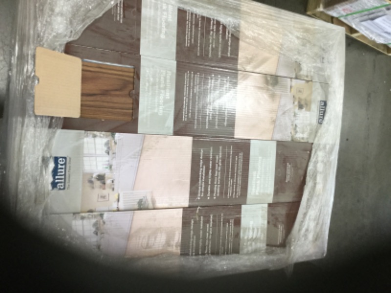 Photo 2 of **SOLD AS WHOLE PALLET ONLY**** NO RETURNS NO REFUNDS*** SLIGHT DAMAGE TO CORNER**** SEE PICTURES
48 CASES 
TrafficMaster
Teak 6 in. W x 36 in. L Luxury Vinyl Plank Flooring (24 sq. ft. / case)