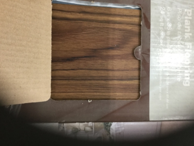Photo 3 of **SOLD AS WHOLE PALLET ONLY**** NO RETURNS NO REFUNDS*** SLIGHT DAMAGE TO CORNER**** SEE PICTURES
48 CASES 
TrafficMaster
Teak 6 in. W x 36 in. L Luxury Vinyl Plank Flooring (24 sq. ft. / case)