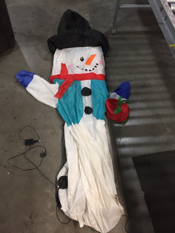 Photo 1 of *USED*
*lights turn on, but blower is out*
Home Accents Christmas Inflatable Snowman with Gift 6.5 ft Tall LED Air Blown
