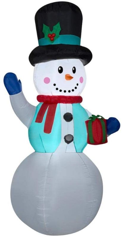 Photo 1 of *USED*
*lights turn on, but blower is out*
Home Accents Christmas Inflatable Snowman with Gift 6.5 ft Tall LED Air Blown
