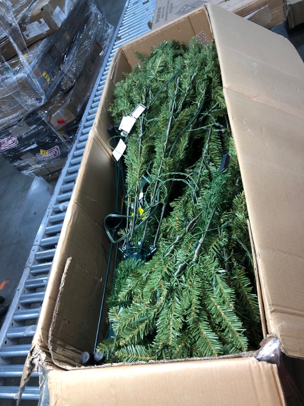 Photo 1 of National Tree Company Pre-Lit Artificial Full Christmas Tree, Green, Dunhill Fir, White Lights, Includes Stand, 9 Feet
