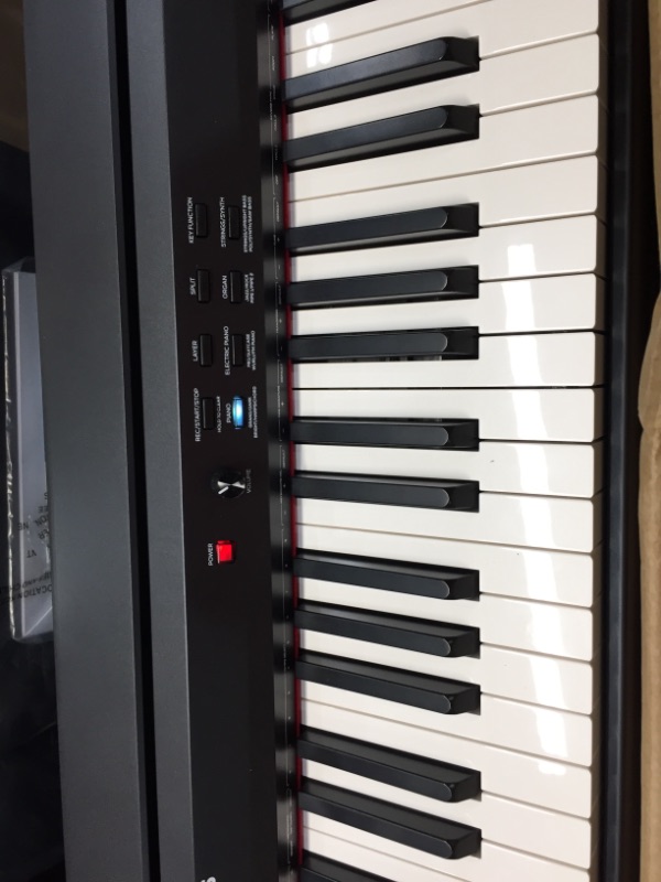 Photo 2 of *Tested and functioned*
*Alesis Recital Grand - 88 Key Digital Piano with Full Size Graded Hammer Action Weighted Keys, Multi-Sampled Sounds, 50W Speakers, FX and 128