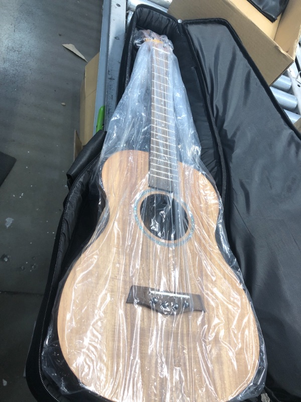 Photo 2 of 
Caramel CB207 Acacia Baritone Acoustic Electric Ukulele with Truss Rod with Additional Strings, Padded Gig Bag, Strap and EQ cable
