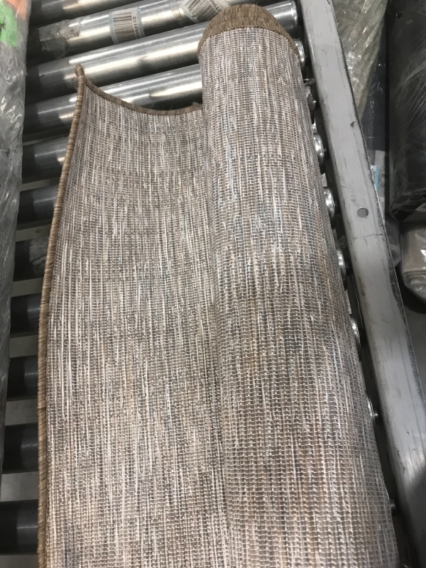 Photo 1 of **GENERAL POST** Tan/brown area rug 5'x7' UNKNOWN BRAND OR STYLE