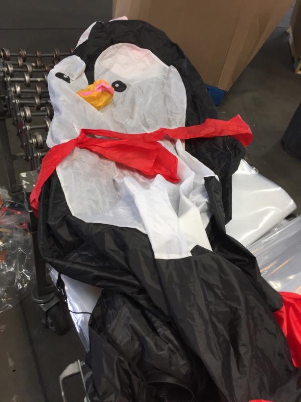 Photo 2 of *** NON FUNCTIONAL***
Home Accents Holiday 6.5 Ft Pre-Lit LED Airblown Penguin with Skates Christmas Inflatable
