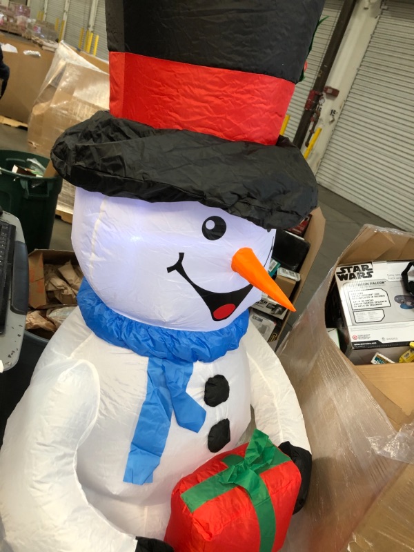 Photo 1 of Home Accents Holiday 6.5 Ft Pre-Lit LED Airblown Snowman Christmas Inflatable

