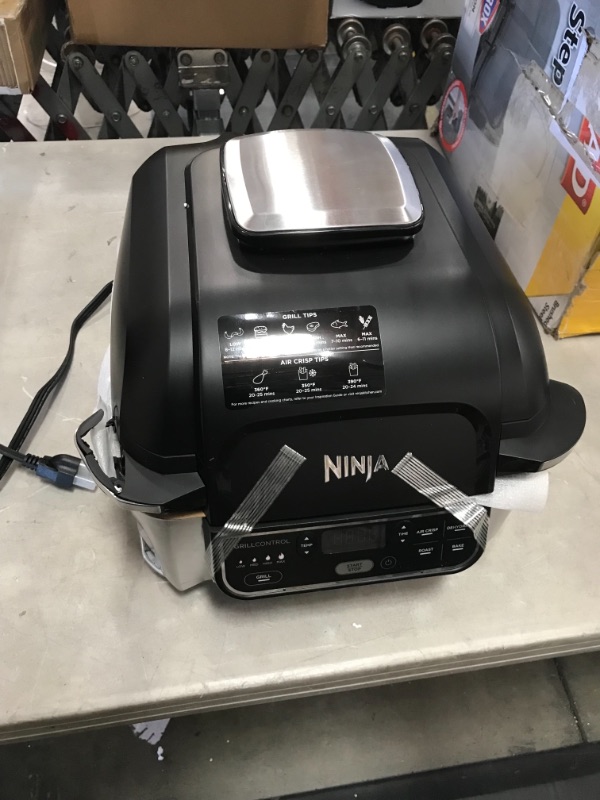 Photo 2 of *SEE last picture for damage*
Ninja AG301 Foodi 5-in-1 Indoor Grill with Air Fry, Roast, Bake & Dehydrate, Black/Silver
